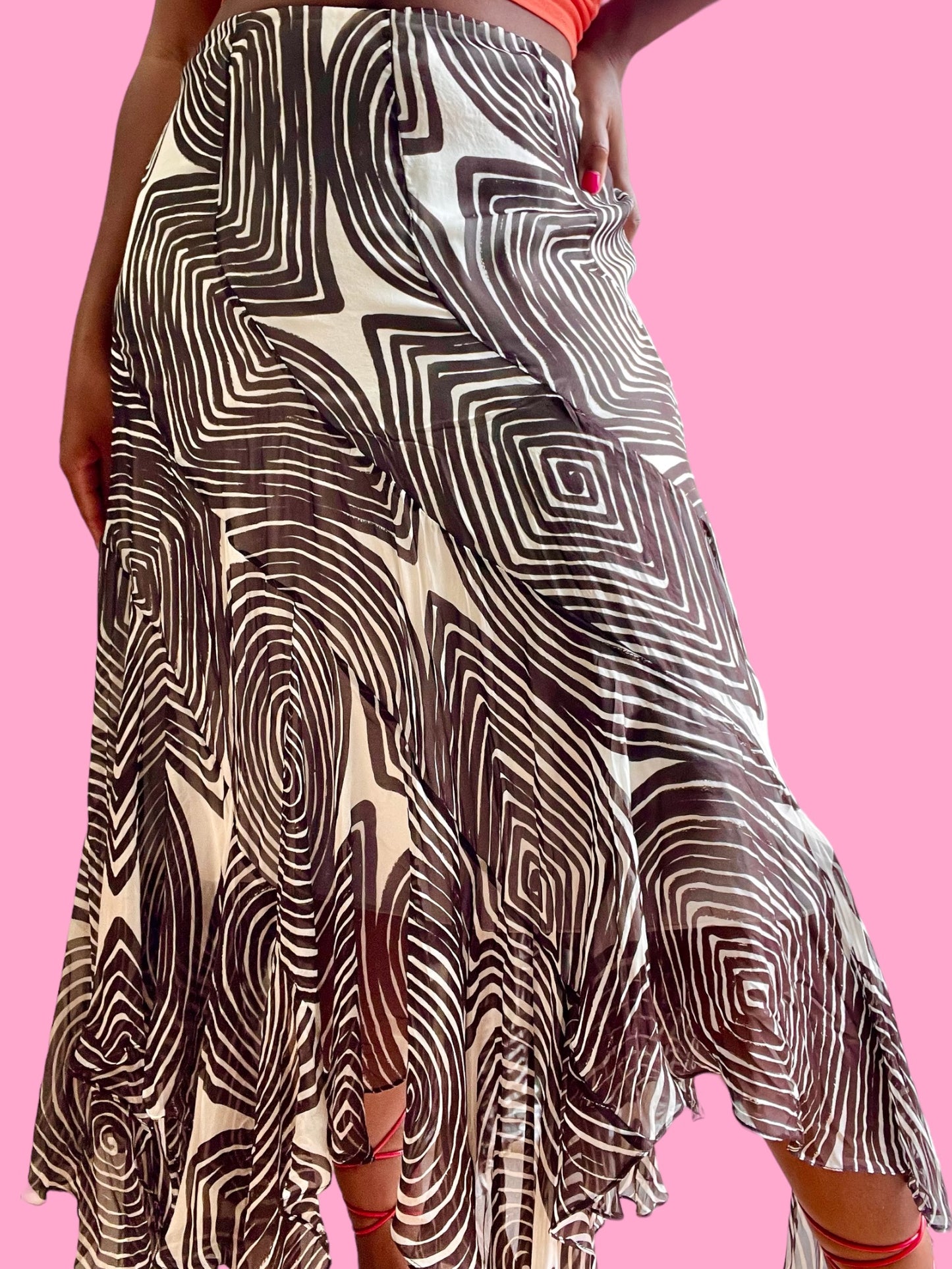 Silk swirl print midi skirt. Hidden side zipper. Slight ruffle flare at bottom.